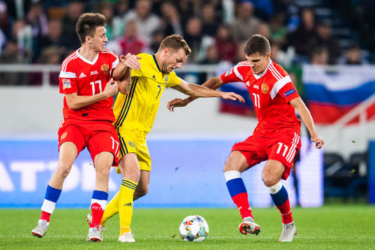 Aleksandr Golovin and Roman Zobnin of Russia competes for