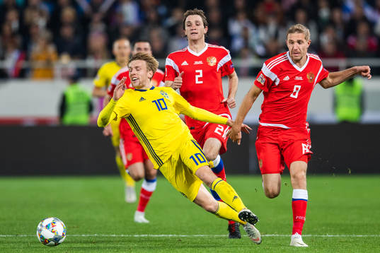 Emil Forsberg of Sweden competes for the ball with