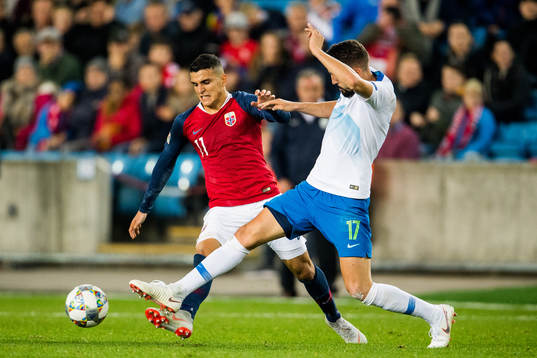 Mohamed Elyounoussi of Norway and Miha Mevlja of Slovenia