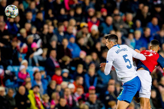 Nemanja Mitrovic of Slovenia and Bjørn Maars Johnsen of