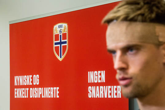 A board with text and Markus Henriksen of Norway