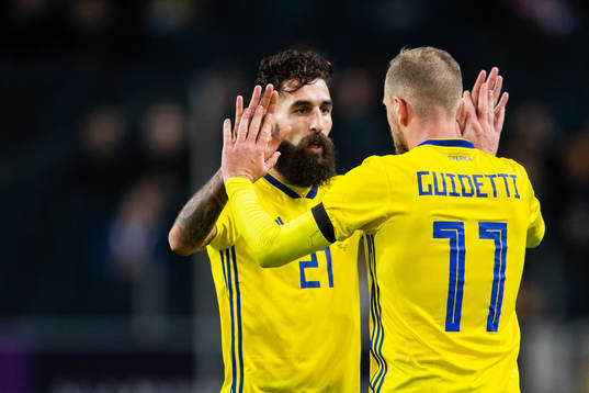 Jimmy Durmaz and John Guidetti of Sweden celebrates