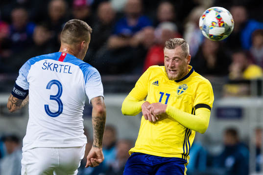 Martin Skrtel of Slovakia and John Guidetti of Sweden