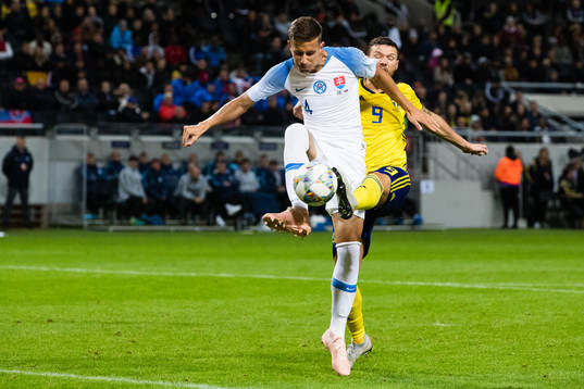 Lubomir Satka of Slovakia and Marcus Berg Marcus Berg