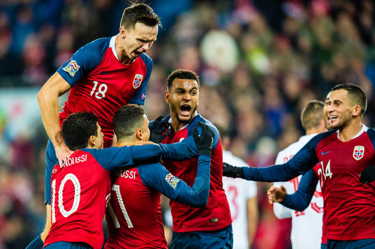 Mohamed Elyounoussi of Norway celebrates with teammates