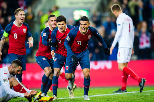 Mohamed Elyounoussi of Norway celebrates with teammates