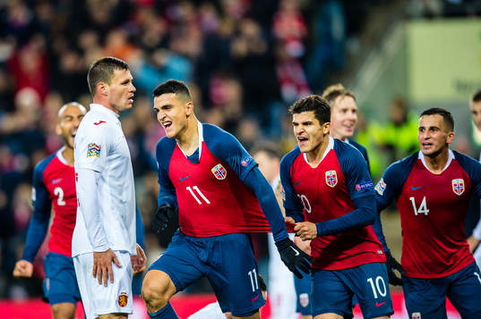 Mohamed Elyounoussi of Norway celebrates with teammates