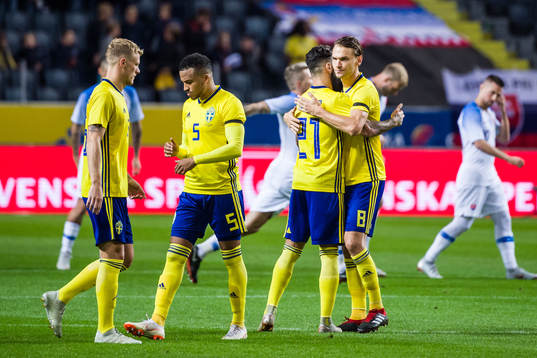 Jimmy Durmaz and Albin Ekdal hug each other