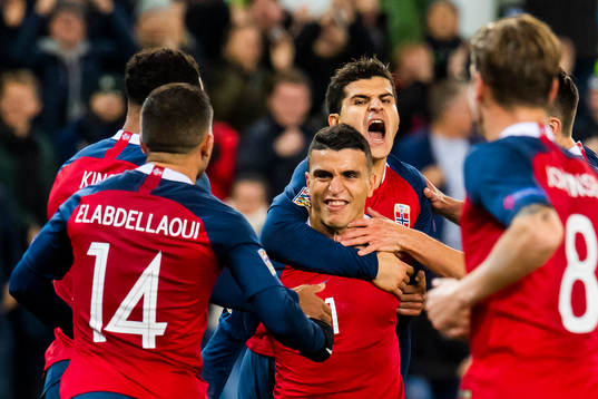 Mohamed Elyounoussi of Norway celebrates with his teammates