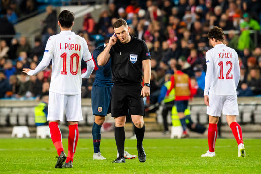 Ivelin Popov of Bulgaria and referee John Beaton of Scotland