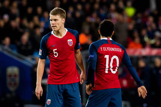 Sigurd Rosted and Tarik Elyounoussi of Norway