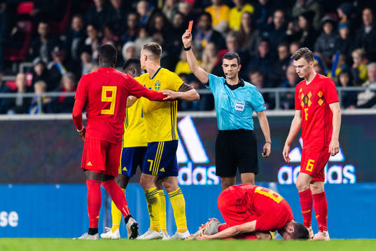 Isak Ssewankambo of Sweden receives a red card