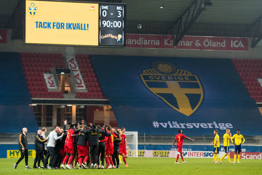 The players of Belgium celebrates and Anton Saletros, Franz