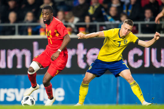Isaac Mbenza of Belgium and Mattias Svanberg of Sweden
