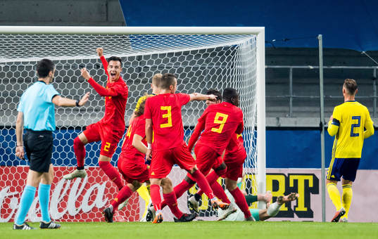 Nany Dimata of Belgium scores the 0-1 goal and celebrates