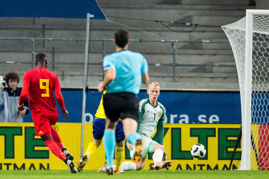 Nany Dimata of Belgium score the 0-2 goal behind goalkeeper
