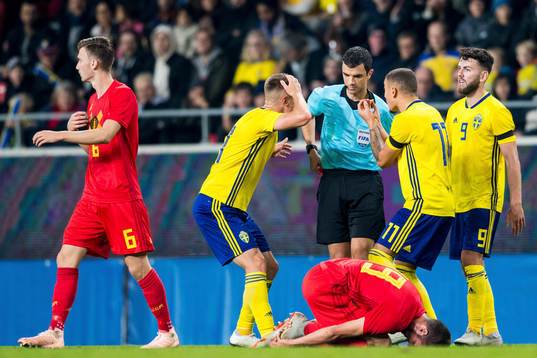 The players of Sweden reacts against referee Frank Schneider