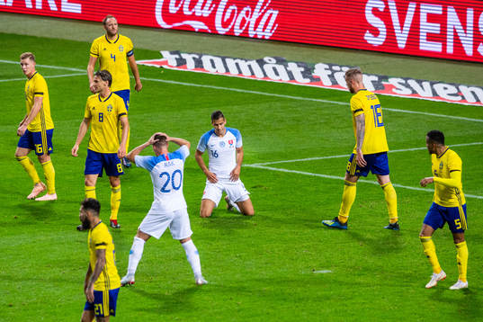 Robert Mak and David Hancko of Slovakia looks dejected