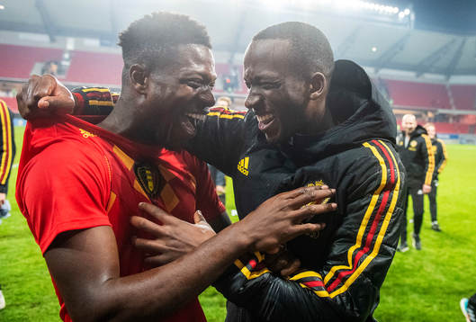 Aaron Leya Iseka and Nany Dimata of Belgium celebrates