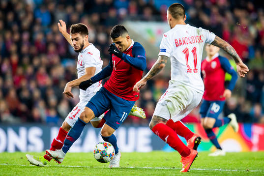 Kristiyan Malinov of Bulgaria and Mohamed Elyounoussi of