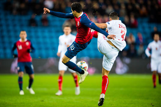 Tarik Elyounoussi of Norway and Petar Zanev of Bulgaria
