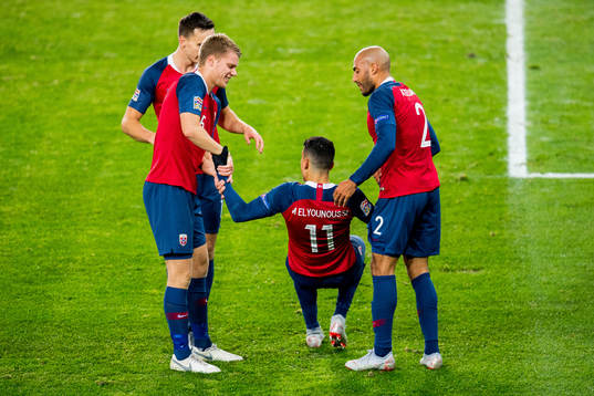 Mohamed Elyounoussi of Norway celebrates with teammates