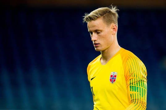 Goalkeeper Sondre Rossbach of Norway looks dejected at half