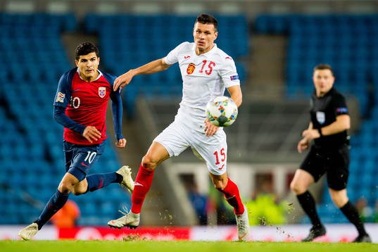 Tarik Elyounoussi of Norway and Vasil Bozhikov of Bulgaria