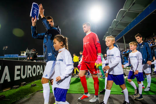 Joachim Thomassen and goalkeeper Aleksandr Vasyutin of