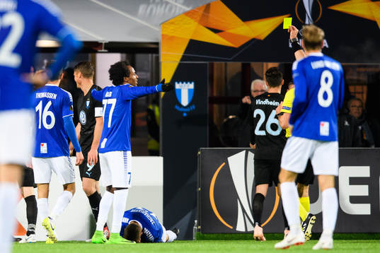 Markus Rosenberg of Malmö FF receives a yellow card