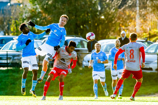 Vidar Nisja of Sandnes Ulf and Charles Chinedu Ezeh of