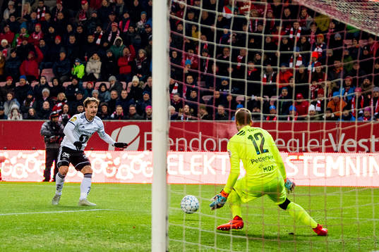 Mike Jensen of Rosenborg scores 2-0 behind goalkeeper