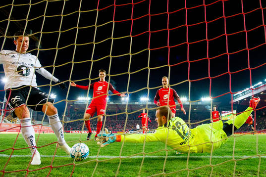 Pål André Helland of Rosenborg sees goalkeeper Markus