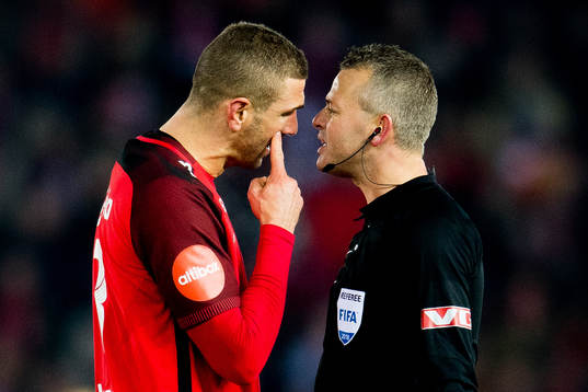 Azar Karadas of Brann argues with Svein Oddvar Moen, referee