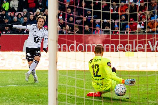 Mike Jensen of Rosenborg scores 2-0 behind goalkeeper