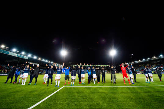 Herman Stengel and the players of Strømsgodset celebrate