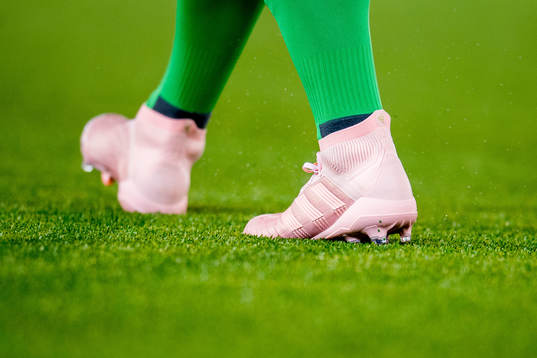 The pink Adidas boots of goalkeeper Marko Maric of