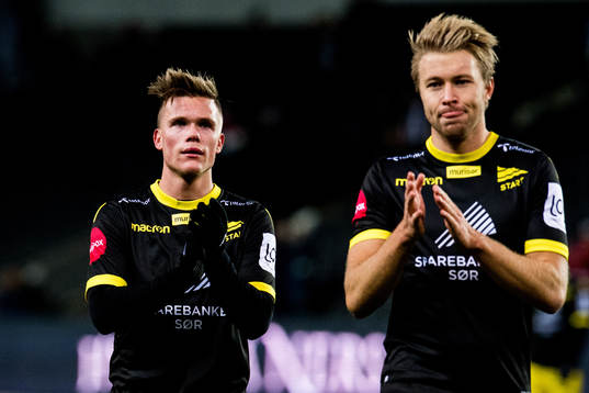 Eirik Wichne and Henrik Robstad of Start look dejected