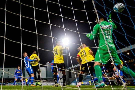 Damion Lowe of Start (hidden) scores 1-1 behind goalkeeper