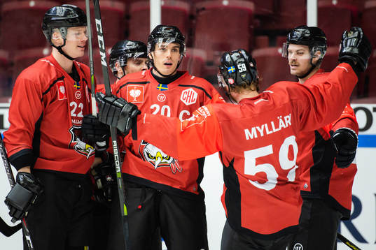 Henrik Hetta of Malmö Redhawks celebrates with teammates