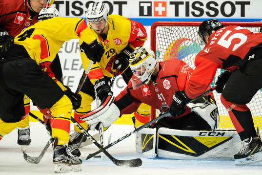 Daniele Grassi of Bern and goalkeeper Lars Volden of Malmö