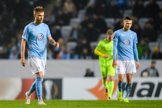 Rasmus Bengtsson of Malmö FF and Romain Gall looks dejected