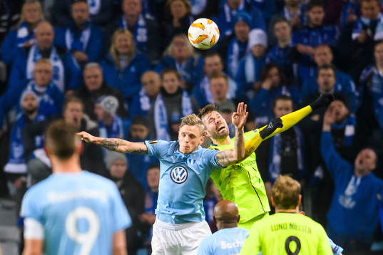 Sören Rieks of Malmö FF in action with Joachim Thomassen