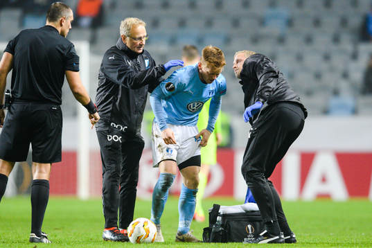 Anders Christiansen of Malmö FF receives medical attention