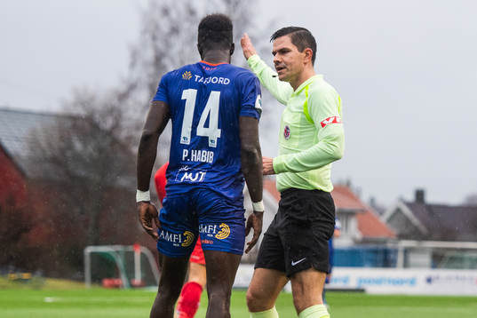Pape Habib Gueye of Aalesund and Steinar Hauge, referee, in