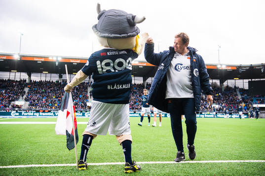 Bjarne Berntsen, head coach of Viking, and a mascot makes a