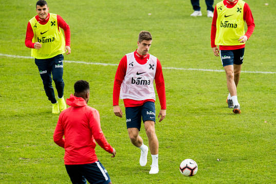 Mohamed Elyounoussi and Markus Henriksen of Norway