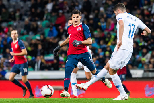 Tarik Elyounoussi of Norway and Miha Mevlja of Slovenia