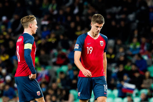 Stefan Johansen and Markus Henriksen of Norway look dejected