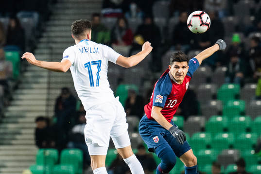 Miha Mevlja of Slovenia and Tarik Elyounoussi of Norway